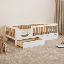 EZRA Montessori toddler bed with white frame, oak veneer rails and open storage drawer