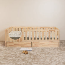 Front view of EZRA Montessori toddler bed on legs with rounded entrance and two closed under-bed storage drawers