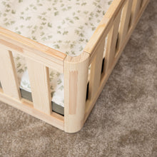 Close-up of the rounded natural pine corner joint on the EZRA Montessori toddler floor bed