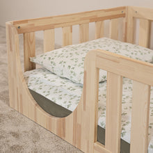 Close-up of the low rounded entrance and safety rail on the EZRA Montessori toddler floor bed