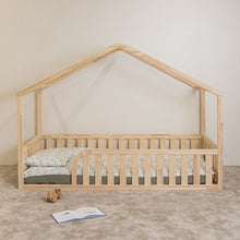 Front view of NOLRI Montessori house floor bed for toddlers with rounded opening and natural pine safety rails
