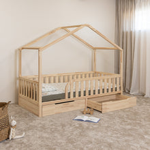 Angled view of NOLRI Montessori toddler house bed with one open under-bed storage drawer