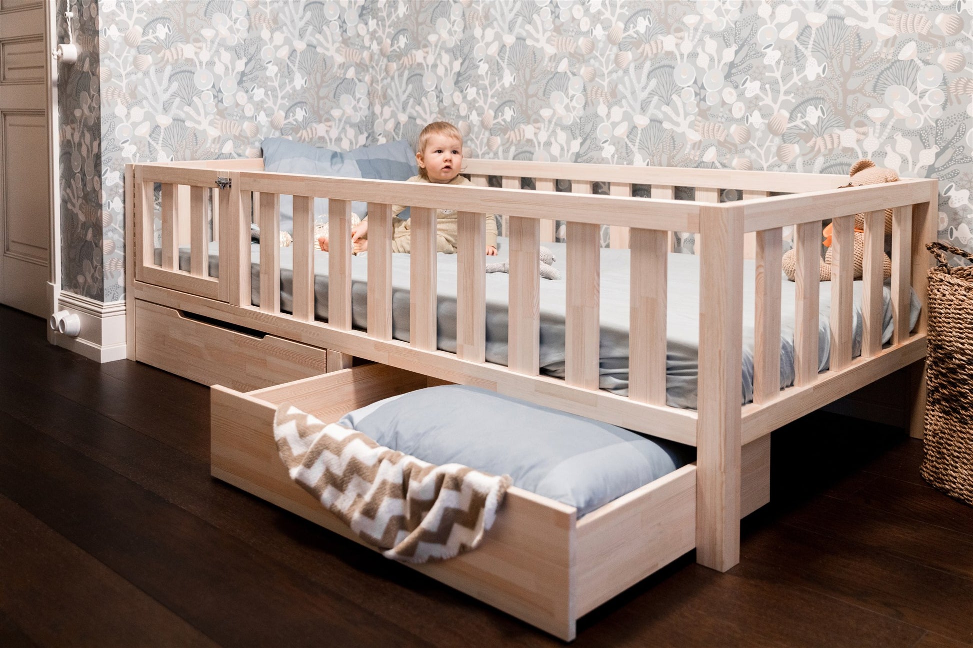 Wooden Montessori toddler bed with rails and built-in storage drawer